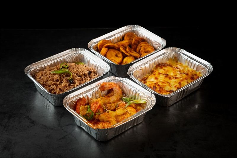 Seafood Curry served with Rice, Peas, Plantain, Mac and Cheese and 1 Drink